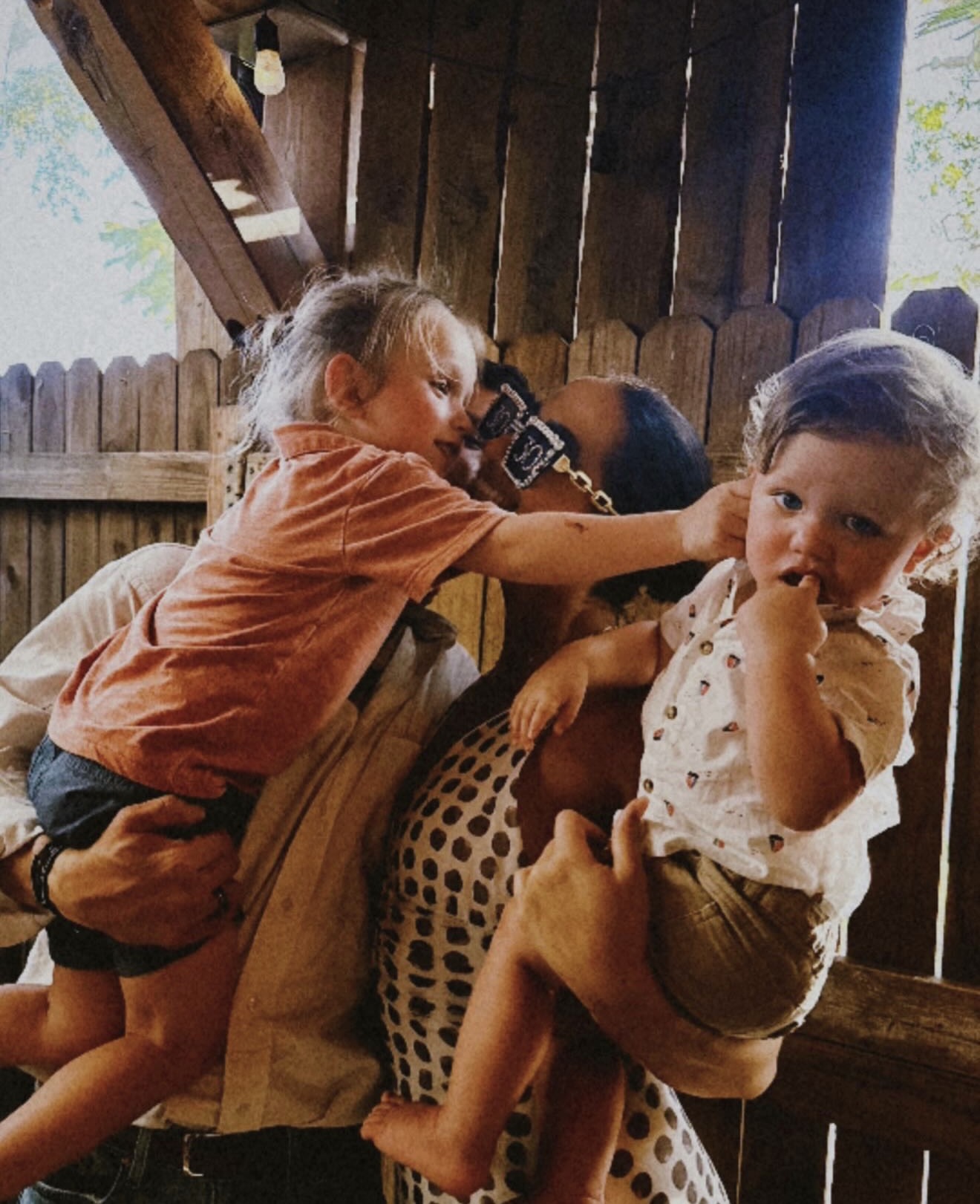Our family carrying the boys and laughing